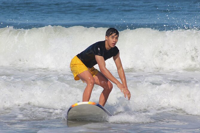 2 Hour Group Surf Lesson in Miami Beach - Carrying the board to the Atlantic