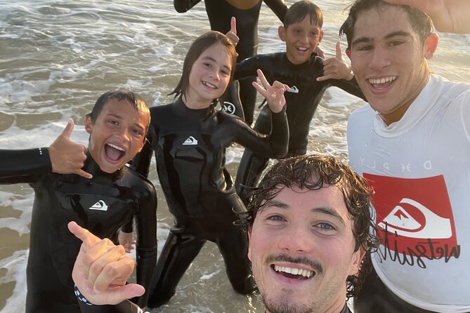 Albufeira Surf Lessons ZEN - Paddling Near Caves and Rock Formations