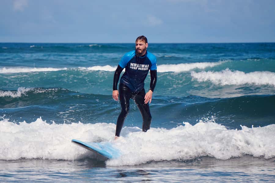 Auckland: Group Surfing Lesson with Muriwai Surf School - The first 15 minutes: arrive ready to get changed