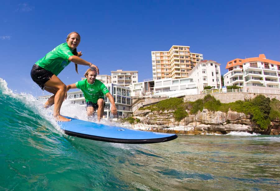 A learner riding a green wall of water at Bondi Beach