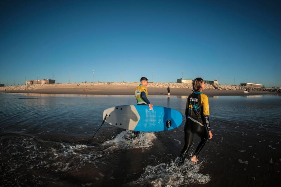 Costa da Caparica: Sunset Surf Lesson - Lisbon on the horizon at sunset