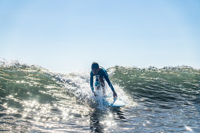 Group Guided Surfing Lesson in Tahiti - Learning to stand, balance, and catch a wave