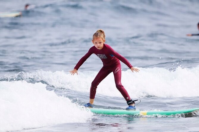 Group Surf Class in Playa de Las Américas with Photographs - Wetsuit, booties, board, and a short warm-up