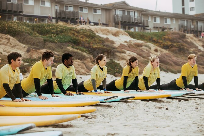 Group Surf Lesson - Getting fitted with a board and wetsuit