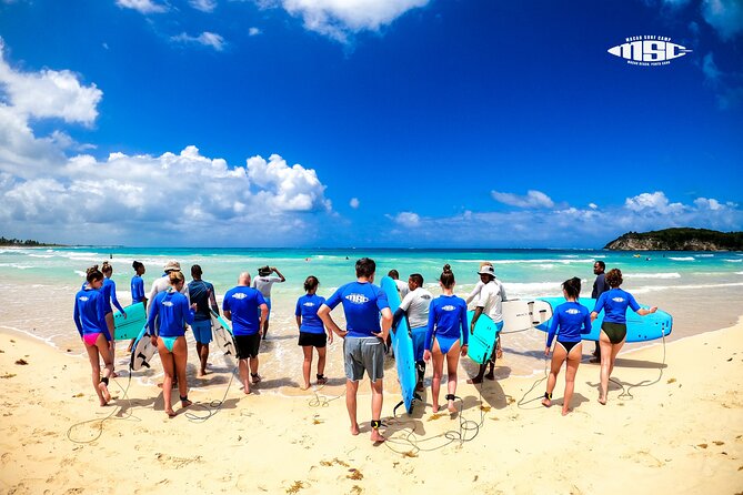 Group Surf Lessons Punta Cana– Fun, Easy & Beginner-Friendly - Getting set up with boards and rash guards