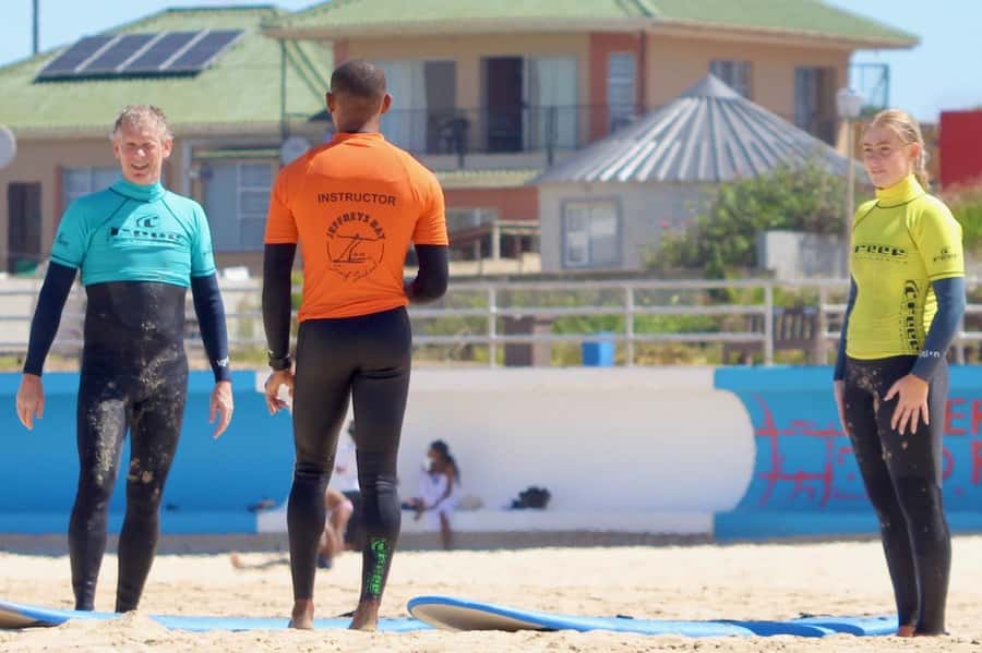 Jeffreys Bay: Learn to Surf Group Lesson - Starting on the beach before entering the water