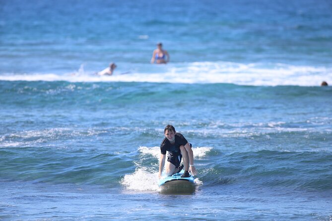 Kona Surf Lesson in Kahaluu - Learning the pop-up before entering the water