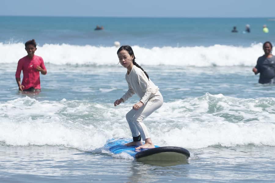 Kuta/Bali: Private Beginner & Intermediate Surf Lessons - Kuta Beach: friendly waves, busy surroundings
