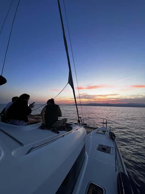 Majorca: Dinner aboard a private catamaran with snorkeling and paddle surfing - Who will get the most from this experience