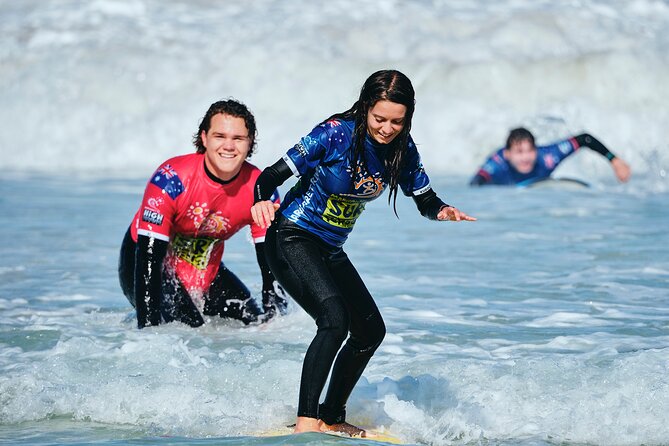 Margaret River Private Surf Lesson - Getting equipped with board, wetsuit, and rash shirt