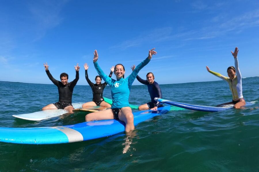 Oahu: Beginner Group Surf Lesson on North Shore - Getting into the water and working toward a first ride