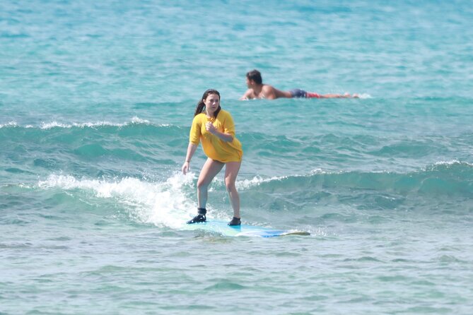 Open Group Surfing Lesson in Waikiki, Hawaii - Standing up is harder than it looks