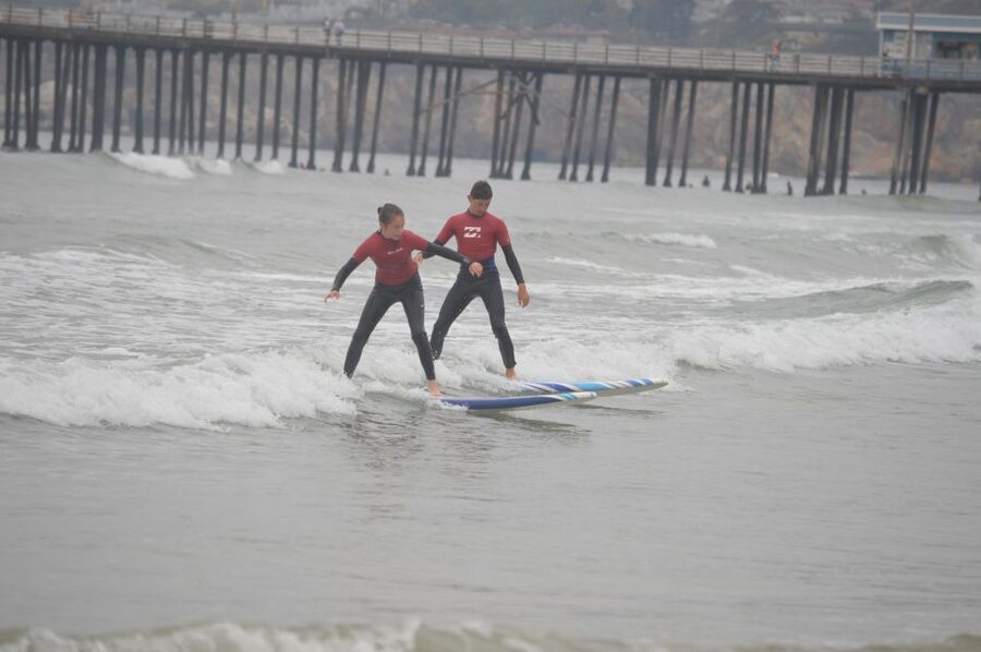 Pismo Beach: Private Group Surf Lesson- all equip included! - Learning the pop-up before chasing waves