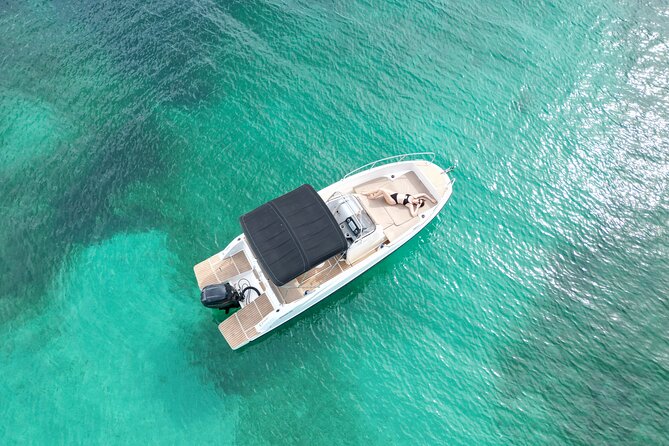 Private Boat Tour of San Antonio with Paddel surfing and Snorkeling - Cala Bassa: paddle, snorkel, and look for the cave