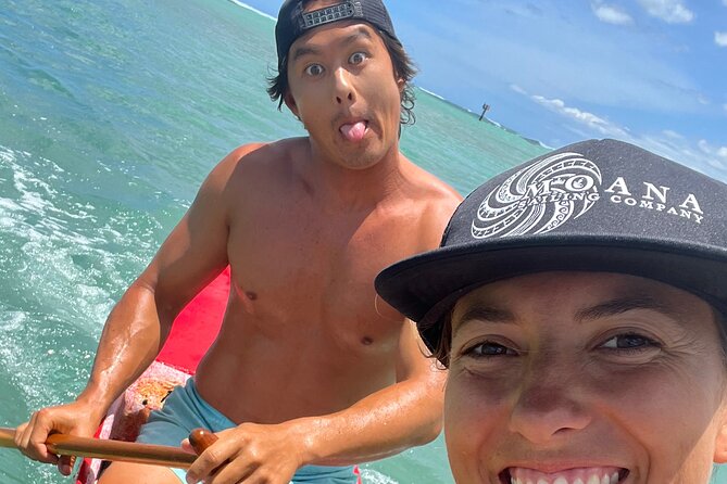 Private Outrigger Canoe Surfing Experience - Catching a wave in an outrigger canoe