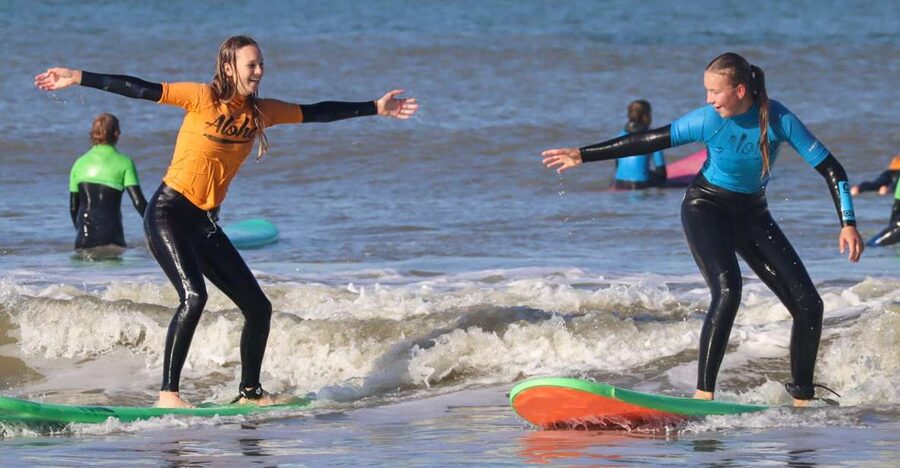 Scheveningen Full-day Surfing lessons with Lunch - Learning the basics before entering the water