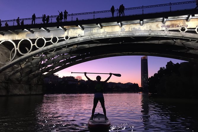 Seville: Sunset in Paddle Surf - The Torre del Oro from the water