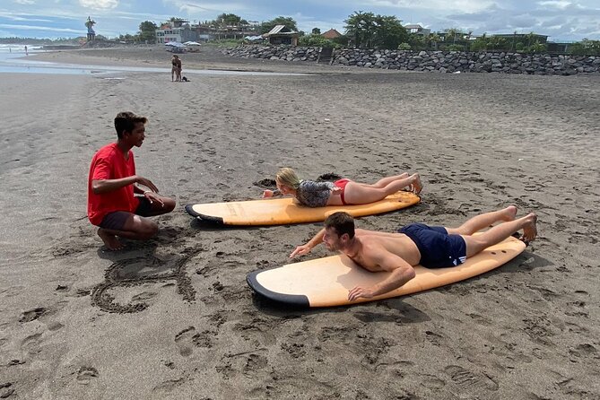 Surfing Trip or Lesson with Coaching in Bali - Practicing the pop-up before the waves arrive