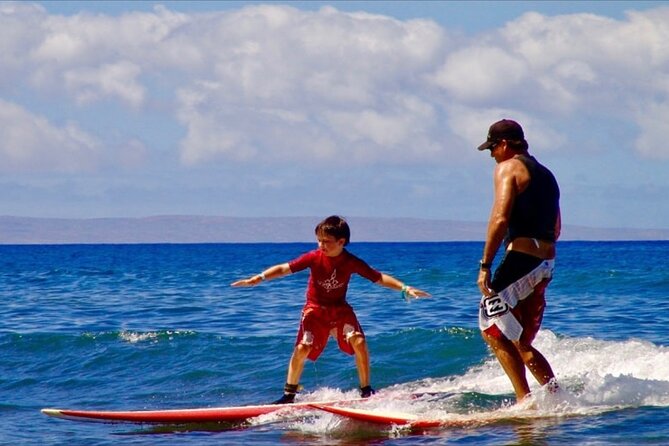Surfing Waikiki with local Firefighters - Taking an included board into Waikiki’s warm water