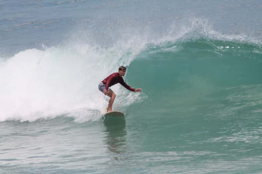 Uluwatu: Surf Lessons Beginner - Getting fitted with a board, wetsuit, and zinc